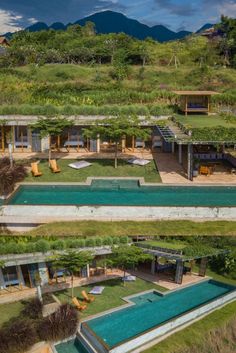 an aerial view of a house with a pool in the foreground and mountains in the background