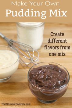 two small bowls filled with chocolate pudding next to a whisk and spoon on a wooden table