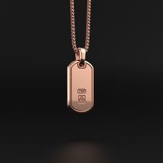 This is your chance to give your outfit a much more modern touch with this 18k rose gold pendant that will look perfect on your neck. Rose gold is increasingly used in men's jewelry because of the subtle reddish touch of copper added to pure gold. It is also more scratch resistant than white gold and yellow gold.This is a jewel to step forward, to make a good first impression and to feel confident. Metal: 18k Rose Solid Gold Pendant Dimensions: H: 34mm x W: 18mm Shown with: Wheat Gold Chain Please note: tag only; chain sold separately Pendant compatible with chains up to 5mm wide 100% Handcrafted Solid Gold items are considered as custom order.Production and shipping takes 15 days.This item is final sale and can't be exchanged or returned.Taxes, duties and shipping costs are included on pr Luxury Rose Gold Jewelry With Shiny Finish, Rose Gold Sterling Silver Jewelry With Rectangular Pendant, Rose Gold Pendant Necklace With Box Chain, Luxury Engraved Rose Gold Necklace, Rose Gold Sterling Silver Rectangular Pendant Jewelry, Luxury 14k Rose Gold Pink Gold Necklace, Modern Rose Gold Necklace With Box Chain, Rose Gold Polished Pendant Necklace, Modern Rose Gold Box Chain Necklace