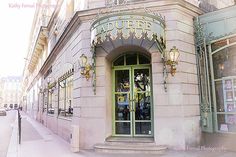 the entrance to an old fashion store in paris