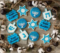 decorated cookies are arranged on a wooden table