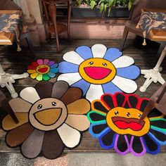 colorful rugs with flowers and faces on the floor