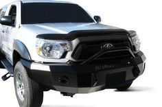 the front end of a white and black toyota pickup truck on a white background with clippings