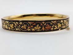 Nice and gently worn 1960s Damasquinado Bangle. Gold.and black motiff.  2 1/2 "   safety chain  Unsigned Good Condition Girly Pop, Bangle Gold, Safety Chain, Favorite Jewelry, Portland, Bangle Bracelets, Beauty Book, 1960s, Jewelry Bracelets