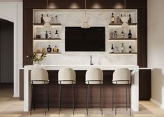 a bar with four stools in front of it and a television on the wall