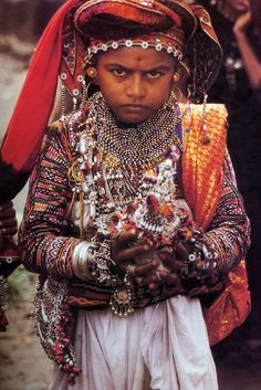 India | Rabari groom carrying a coconut | Image taken from the publication “Dowries for the Kutch” by Vickie C Elson Coconut, Books