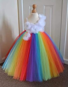 Stunning Rainbow Style Tutu Dress This fabulous Full Length Rainbow Style Tutu Dress has been made with 3 layers of top quality soft tulle, with a high waistline in rainbow colours, tulle flowers complete with gems to give the dress a elegant look & a big beautiful bow giving the finishing touches which any princess would love!  Our stunning creations are fabulous for Birthday, 1st Birthday, Parties, Party Gifts, Gifts for Girls & Kids, Costume Party, Fancy Dress Party, Dress Up, Halloween, Chri Rainbow Tutu Dress, Costume Carnevale, Princess Tutu Dresses, Pink Tutu Skirt, Ribbon Trim Tutu, 1st Birthday Tutu, Princess Tutu Dress, 1st Birthday Dresses, Handmade Tutu