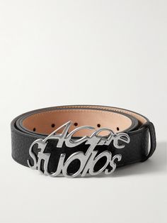 Acne Studios' belt has a burnished silver-tone buckle that features the logo in warped letters that make it look as though you're seeing them through a fish-eye lens. It's made from full-grain leather and has a soft nubuck underside that'll loop smoothly through the waistband of your trousers. Silver Leather Belt With Logo Plaque, Silver Leather Belt Buckle With Logo Plaque, Designer Silver Leather Belt, Designer Leather Belt Buckles With Logo, Designer Leather Belt Buckles With Metal Logo, Luxury Leather Belt Buckles With Logo, Designer Leather Belt With Logo, Modern Leather Belt With Engraved Logo, Modern Formal Belt Buckles With Logo