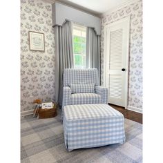 a chair and ottoman in the corner of a room with blue checkered wallpaper