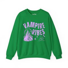 Sink your teeth into Halloween fashion with the Eddy and Rita Women's Heavy Crewneck Sweatshirt featuring the phrase "Vampire Vibes" in a spooky, stylish design. This heavyweight sweatshirt provides maximum warmth and comfort, making it perfect for those crisp autumn nights. With its relaxed fit, this sweatshirt is ideal for layering over your favorite Halloween ensemble or wearing solo for a cozy night in. Whether you're hitting a Halloween party, trick-or-treating, or just enjoying the season, Punk Halloween Sweatshirt With Graphic Print, Punk Style Halloween Sweatshirt With Graphic Print, Green Halloween Sweatshirt For Streetwear, Punk Halloween Sweatshirt With Letter Print, Green Halloween Graphic Print Sweatshirt, Gothic Long Sleeve Sweatshirt With Graphic Print, Gothic Halloween Graphic Sweatshirt, Vampire Vibes, Crisp Autumn