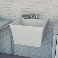 a white sink sitting under a window next to a counter