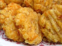 some fried food on a red and white plate