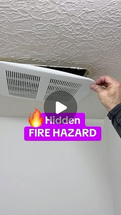 a man is fixing the ceiling heater in his room with text that reads hidden fire hazard