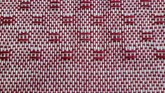 red and white checkered fabric with small stitchs