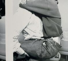 black and white photograph of two people hugging each other