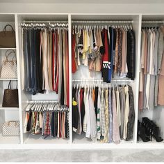 an organized closet with clothes and handbags