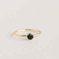 Leona Gold Stacking Ring | Black Onyx - elliparr Black Stone Ring Gold, Sleek Round Band Jewelry For Everyday, Sleek Everyday Rings With Round Band, Sleek Round Band Rings For Gifts, Sleek Everyday Round Band Jewelry, Sleek Everyday Rings, Black Dainty Stackable Jewelry, Dainty Black Stackable Jewelry, Modern Everyday Crystal Ring