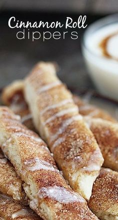 cinnamon roll dippers are stacked on top of each other in front of a bowl