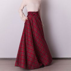 Red plaid skirt: - Side seam pockets - Hidden zipper in the side seam - Separate sash - Classic tartan pattern - Fabric is 40% wool, 58% polyviscose, 2% of elastane Model is 6'2'', she wears US 8 US 0  Bust 82 cm (32.5 inches) Waist 64 cm (25 inches) Hips 89 cm (35 inches) US 2  Bust 85 cm (33.5 inches) Waist 66 cm (26 inches) Hips 92 cm (36 inches) US 4  Bust 88 cm (34.5 inches) Waist 68 cm (27 inches) Hips 94 cm (37 inches)  US 6  Bust 90 cm (35.5 inches) Waist 71 cm (28 inches) Hips 96 cm (38 inches)  US 8  Bust 93 cm (36.5 inches) Waist 74 cm (29 inches) Hips 99 cm (39 inches) US 10  Bust 95 cm (37.5 inches) Waist 76 cm (30 inches) Hips 102 cm (40 inches) US 12  Bust 99 cm (39 inches) Waist 80 cm (31.5 inches) Hips 105 cm (41.5 inches) US 14  Bust 103 cm (40.5 inches) Waist 84 cm (33 i Red Maxi Skirt For Fall, Plaid Skirt With Pockets For Winter, Scottish Plaid Skirt For Winter, Winter Scottish Plaid Skirt, Scottish Red Skirt For Fall, Scottish Style Plaid Winter Bottoms, Christmas Outfit Women, Red Tartan Skirt, Red Christmas Outfit