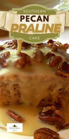 a piece of pecan pralie cake sitting on top of a white plate