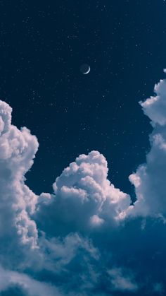 the night sky is full of stars and clouds with a half moon in the distance