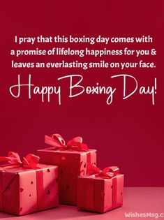 three boxes with red bows on them and the words happy boxing day