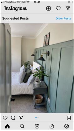 a bed room with a neatly made bed next to a green cabinet and some pictures on the wall