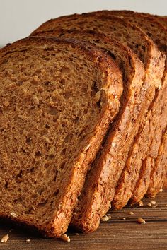 several slices of bread sitting on top of a wooden table