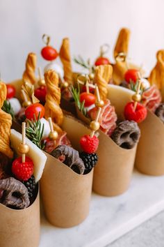 small cups filled with food on top of a table