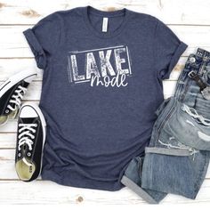 Our shirts are handmade in Ohio by hand with love and care one at a time.We hope you will find a shirt that will inspire you or someone else.Description:Lake Life Shirt, Summer Shirt, Lake Bum, Boating Shirt, Lake Mode, Lake Vacation Shirt, Lake Shirt, Lake Life Shirts, Lake Tee, Lake Life T-ShirtThis cute Lake Mode tee is a must. We use a high-quality unisex t-shirt that is insanely soft. In fact, it will be one of the softest, best-fitting, most comfortable shirts you’ve ever owned.CLICK BELOW Casual Shirt With Text Print And Comfortable Fit, Simple Summer T-shirt With Letter Print, Summer Tri-blend Ring-spun Cotton T-shirt, Tri-blend Ring-spun Cotton T-shirt For Summer, Summer Soft-washed Ring-spun Cotton T-shirt, Soft-washed Ring-spun Cotton T-shirt For Summer, Soft-washed Ring-spun Cotton Summer T-shirt, Summer Shirt With Text Print For Everyday, Casual Ring-spun Cotton T-shirt For Spring