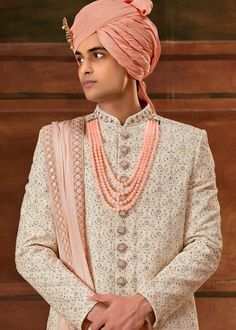 Men Off White Designer Groom Sherwani
Designer custom made ivory fully embroidered sherwani with chudidar in UK . The latest heavy silk embroidered sherwani is best choice for groom . It is suited for Indian and Pakistani wedding wear . 
One of the standout features of this sherwani is the intricate embroidery adorning its surface. Our skilled artisans have meticulously handcrafted every detail, using fine threads and intricate patterns that showcase traditional Indian craftsmanship at its best. The embroidery showcases a harmonious blend of motifs, ranging from floral designs to intricate geometric patterns, creating a visually stunning ensemble that captures attention and admiration . Please note there can be slightly difference between the image and the product due to screen resolutio Embroidery Online, Indian Wedding Outfits, Thread Embroidery