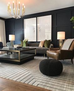 a living room filled with furniture and a chandelier