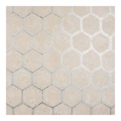 a white tiled floor with hexagonal tiles