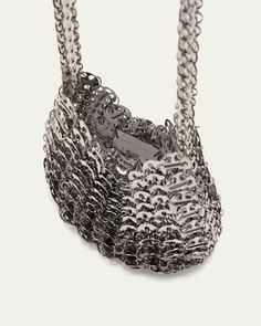 Paco Rabanne "1969 Moon" shoulder bag in disclink brass     Chain shoulder strap    Open top     Unlined     Approx. 8.3"H x 15"W x 1"D    Imported Metal Evening Bag, Evening Metal Chain Shoulder Bag, Silver Crossbody Evening Bag With Chain Strap, Silver Crossbody Shoulder Bag With Chain Detail, Silver Crossbody Shoulder Bag With Chain, Silver Chain Crossbody Shoulder Bag, Metal Shoulder Bag For Evening, Rectangular Metal Shoulder Bag With Chain Strap, Chic Metal Shoulder Bag With Chain Strap