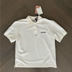 Miu Miu Logo Embroidered Cotton Polo Shirt White Size Xs Brand New With Tags. Miu Miu White Shirt, Miu Miu Cotton Collared Tops, Miu Miu Collared Cotton Tops, Classic Miu Miu Cotton Tops, Classic Cotton Miu Miu Tops, Casual Collared Tops By Miu Miu, Designer Embroidered Collared Tops, Designer Embroidered Cotton Top, Designer Cotton Top With Collared Neckline