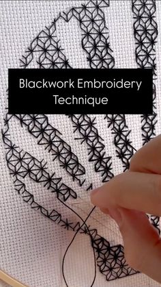 someone is stitching an embroidery pattern on a piece of fabric with the words, blockwork embroidery technique