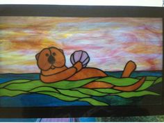 a stained glass picture of a dog floating on the water with a ball in it's mouth