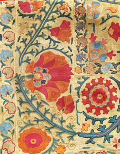 an old rug with flowers and leaves on it