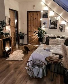 a bed room with a neatly made bed and a cat on the floor next to it