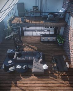 an aerial view of a living room and dining area in a loft style apartment with wood floors