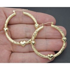 Treat Yourself To The Luxe Look With These Exquisite 10k Solid Gold Triple Heart Bamboo Graduated Hoop Earrings. Delicately Handcrafted From Solid Gold, Each Earring Features A Graduated Hoop Design With Three Heart-Shaped Charms To Add An Elegant Touch. Weighing 3.8 Grams And Measuring 46mm In Diameter, These Timeless Beauties Will Instantly Elevate Your Style. Specifications: Metal: Real 10k Yellow Gold (Stamped, 10k) Condition: Brand New Polished: Shiny Gold Weight 3.8 Grams Hanging Length: 4 Triple Heart, Hoop Design, Solid Yellow, Timeless Beauty, Solid Gold, Gold Jewelry, Jewelry Earrings, Hoop Earrings, Charms