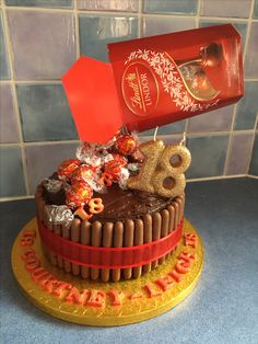 a birthday cake decorated with chocolate and candies