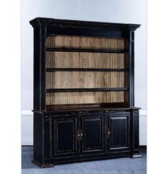 an old black bookcase with wooden doors and drawers on the bottom shelf is shown