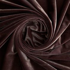 a close up view of a dark purple fabric