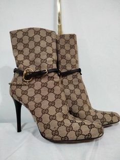 This 100% authentic Gucci GG monogram boot( 38 and half)5.5 is a must have! It's absolutely gorgeous and stylish. It fits every occasion. It's almost new! You can wear it  occasionally or casually. It's unique design commands an epitome of class and style. It's medium heeled with zips on its sides showcasing an elaborate chain design added to a finished leather cowboy rope! Gucci Aesthetic, Monogram Boots, House Additions, Gucci Boots, Diy Clothes And Shoes, Outfit Inspired, Gg Monogram, Hot Heels, Beautiful Boots