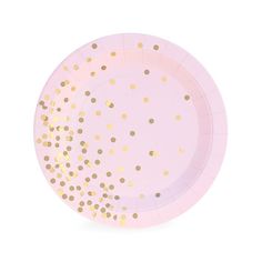 a pink paper plate with gold dots on it