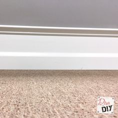 a dog is sitting on the floor next to a sign that says do it diy