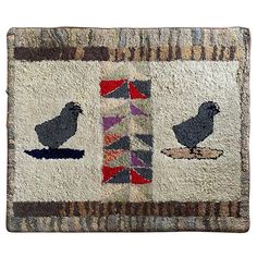 a rug with two birds on it