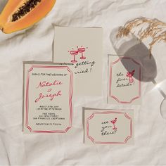 the wedding stationery is laid out on paper