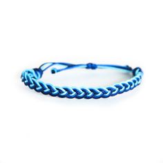 This summer bracelet with its wave pattern from our Sup Beaches collection is perfect for your beach ensemble.  * Dark Aqua, Cyan, & Royal Blue. * Hand made with high quality nylon knotting cord. * Available in multiple sizes and adjustable knot closure for the perfect fit every time. Shop the Sup Beaches Collection here: https://etsy.me/3yoeYts Check out all our Rally Strings bracelets here: www.etsy.com/shop/RallyStrings 🌟 Size and Materials: Bracelets are made using sturdy nylon knotting cor Adjustable Blue Wristband With Jubilee Bracelet, Adjustable Blue Wristband, Adjustable Blue Jubilee Wristband, Blue Braided Bracelet With Sliding Knot For Summer, Blue Wristband For Beach, Casual Blue Braided Bracelets For Vacation, Casual Blue Braided Bracelet For Vacation, Blue Resizable Braided Bracelets For Beach, Blue Resizable Braided Bracelet For Beach